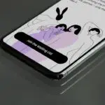 a cell phone with a picture of two people on it