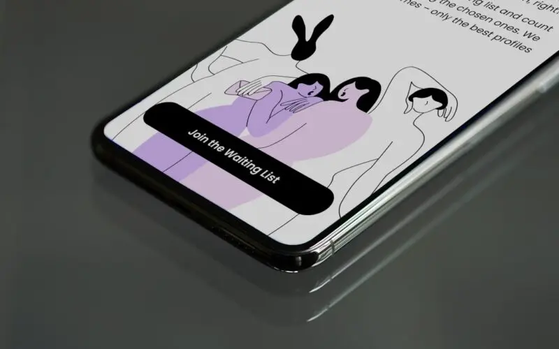 a cell phone with a picture of two people on it